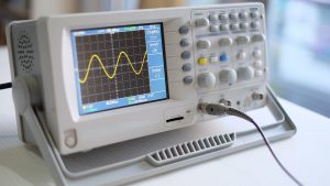 Image of an oscilloscope showing a wave oscillating — the main principle behind the electromagnetic spectrum and uv-vis spectroscopy